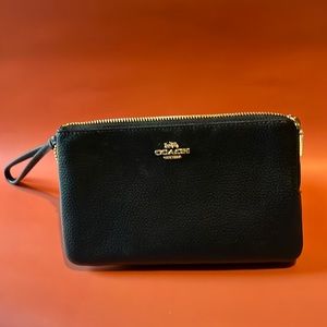 Coach wristlet with 2 compartments.